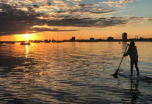 How Stand Up Paddle Board Lessons Can Boost Your Balance and Core Strength