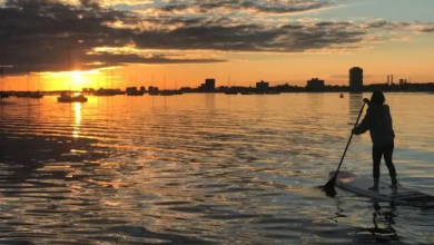 How Stand Up Paddle Board Lessons Can Boost Your Balance and Core Strength