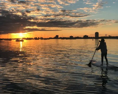 How Stand Up Paddle Board Lessons Can Boost Your Balance and Core Strength